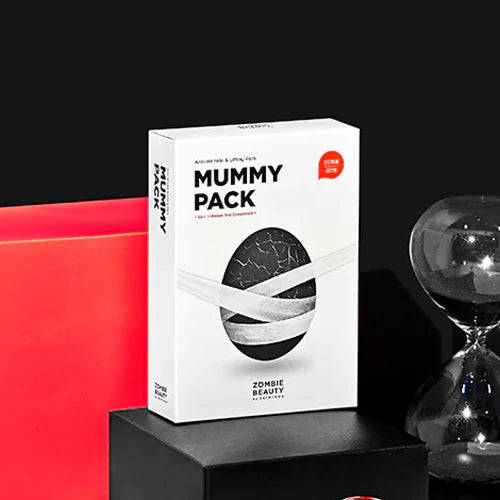 Mummy Pack box with a black and white design on a black platform with a red background